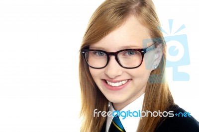 Closeup Shot Of Smiling Schoolgirl In Eyeglasses Stock Photo