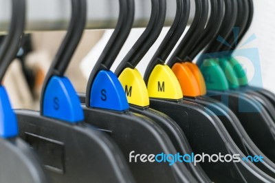 Cloth Hanger With Color Sizing Label Stock Photo