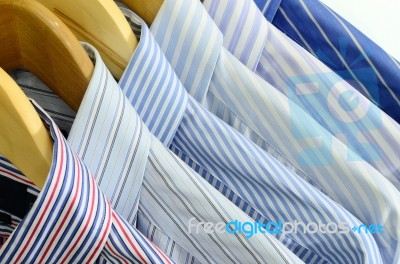 Clothes On Wooden Hangers Stock Photo