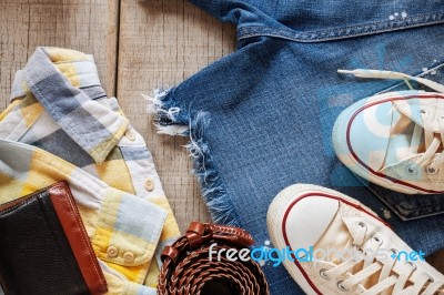 Clothing On Wooden Floor Stock Photo