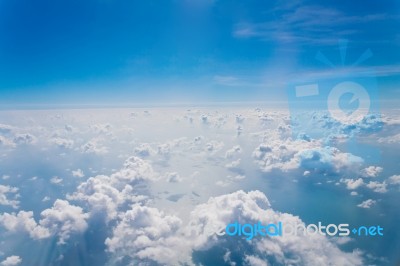 Clouds And Sky Blue, Viewed From An Airplane Window Stock Photo