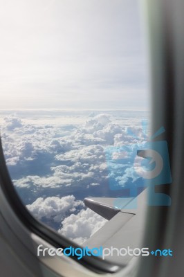Cloudy Sky View From Airplane Cabin Window Stock Photo