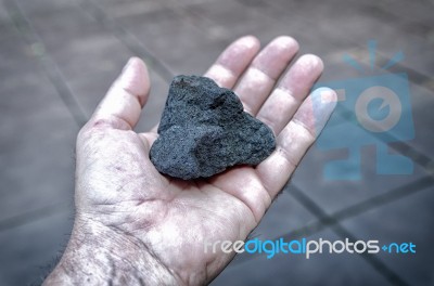Coal In Hand Stock Photo