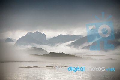 Coast Of  Norway Sea In Clouds Of Fog. Cloudy Nordic Day Stock Photo