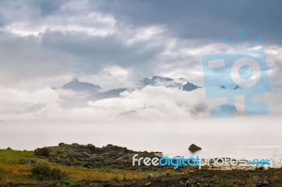 Coast Of  Norway Sea In Clouds Of Fog. Cloudy Nordic Day Stock Photo
