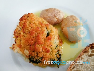 Codfish With Bread Crumbs And Potatoes Stock Photo