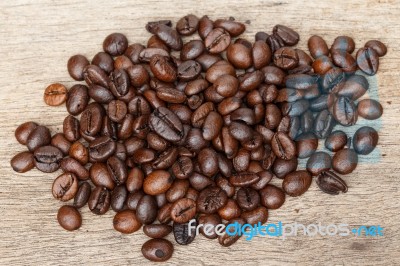 Coffee Bean On The Wooden Floor Stock Photo