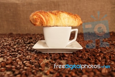 Coffee Beans And Croissant Stock Photo