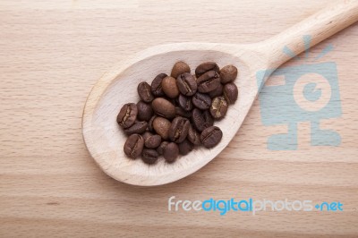 Coffee Beans In Spoon Stock Photo