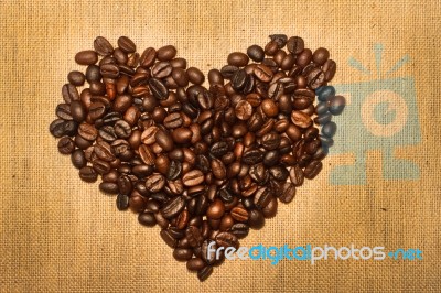 Coffee Beans  In The Shape Of The Heart Stock Photo