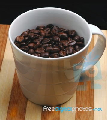 Coffee Beans On A Cup Stock Photo
