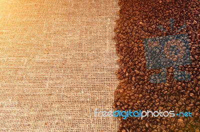 Coffee Beans On Sackcloth In Sunligh Stock Photo
