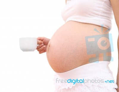 Coffee Cup Of Pregnant Woman On White Background Stock Photo