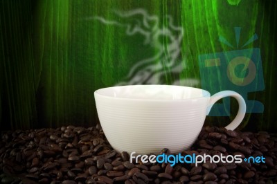 Coffee Cup On Coffee Beans Stock Photo