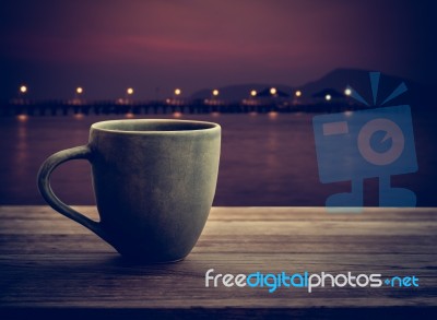 Coffee Cup On Wooden Plank Stock Photo
