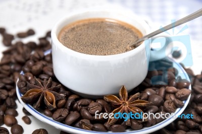 Coffee Cup With Spreaded Beans Stock Photo