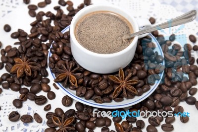 Coffee Cup With Spreaded Beans Stock Photo