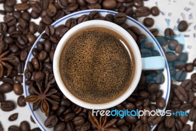 Coffee Cup With Spreaded Beans Stock Photo