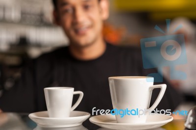 Coffee For You, Restaurant Staff In Background Stock Photo