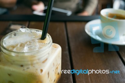 Coffee, Iced Coffee On Table Wood In Cafe In Front Of Blur Women… Stock Photo