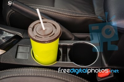 Coffee Or Tea Mugs Green Placed On The Vehicle Console In Modern Luxury Car Interior Stock Photo