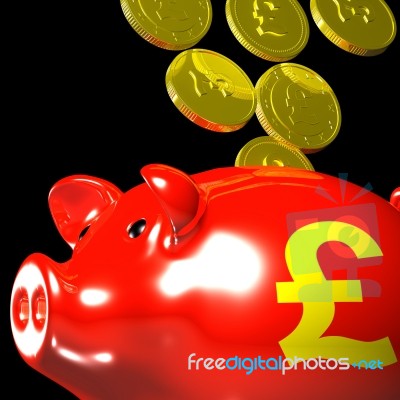 Coins Entering Piggybank Showing British Wealth Stock Image