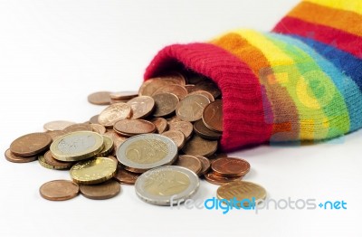 Coins Spill From Wool Pouch  Stock Photo
