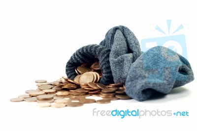 Coins Spill From Wool Sock Stock Photo