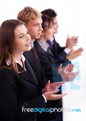 Colleagues Applauding During A Business Meeting Stock Photo