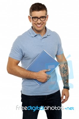 College Student Holding Notebook Stock Photo