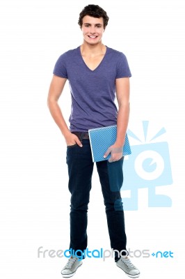 College Student Holding Notebook Stock Photo