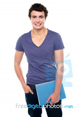 College Student Holding Notebook Stock Photo