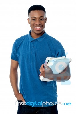 College Student Holding Notebooks Stock Photo