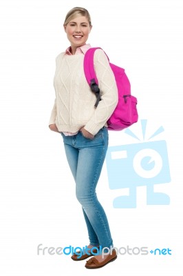 College Student In Winter Wear Posing With Pink Backpack Stock Photo