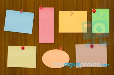 Colored Notes On Old Wooden Board Stock Photo