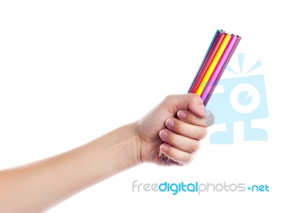 Colored Pencils In A Female Hand On A White Background  Stock Photo