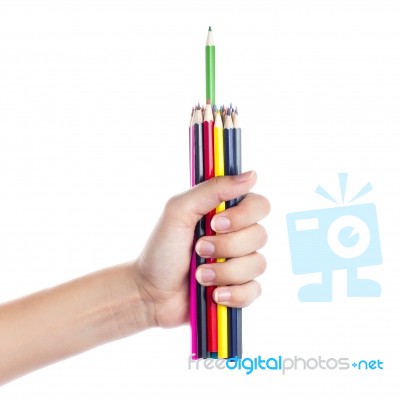 Colored Pencils In A Female Hand On A White Background  Stock Photo