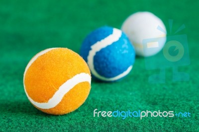 Colorful Balls On Lawn Stock Photo