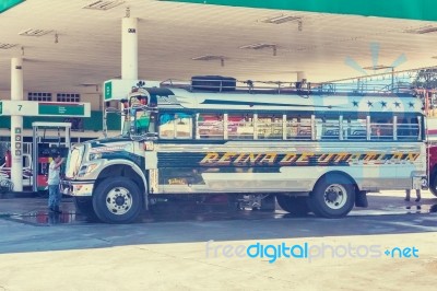 Colorful Bus At Gas Station In Small Town Of Chinique, Guatemala… Stock Photo