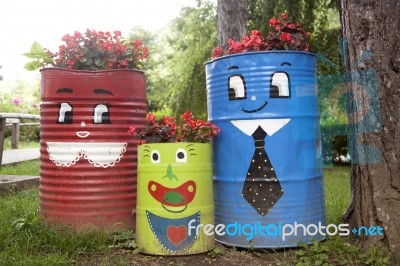 Colorful Flower Pots Made Of Metal Barrel Stock Photo