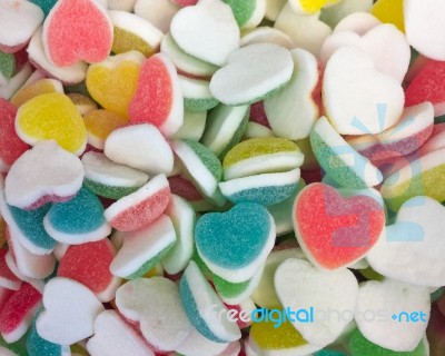 Colorful Heart Shape Jelly Candy Bonbon Snack Group. Sweet For Valentines Day Background. Pastel Color In Red Blue Green Yellow Pink Stock Photo