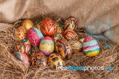 Colorful Painted Easter Egg On Hay Stock Photo