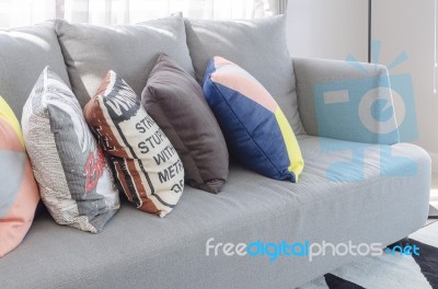 Colorful Pillows On Modern Grey Sofa Stock Photo