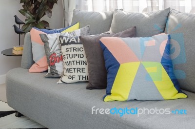 Colorful Pillows On Modern Grey Sofa In Living Room Stock Photo