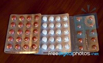 Colorful Pills In Containers Stock Photo