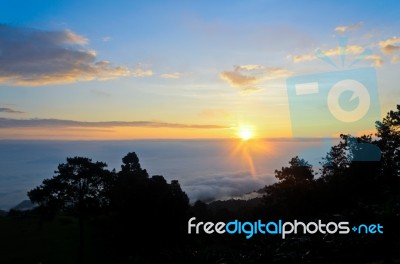 Colorful Sunrise Above The Clouds Stock Photo