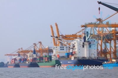 Commercial Container Ship On Port Use For Water Transport And Sh… Stock Photo