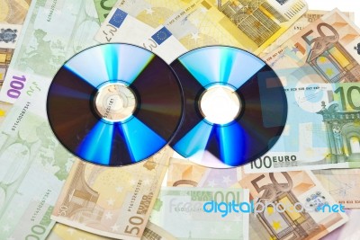 Compact Disks With Euro Money Stock Photo