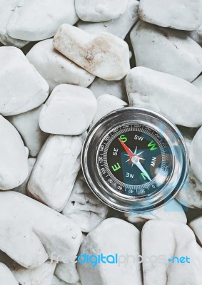 Compass On Pebbles Stock Photo