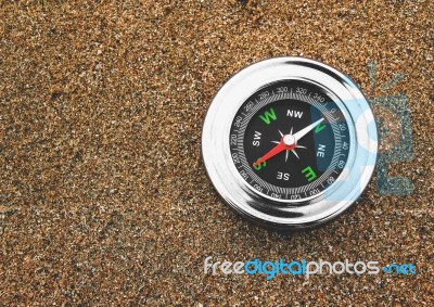Compass On Sand Stock Photo